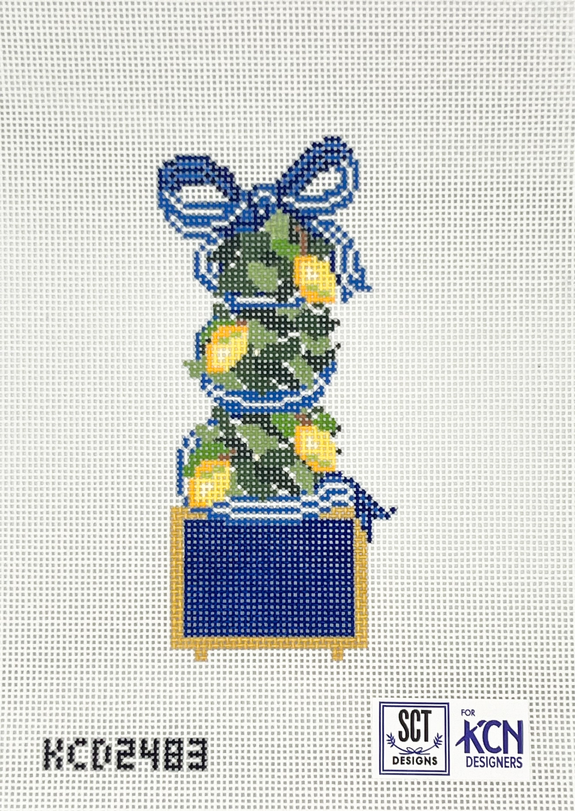 Needlepoint design featuring a lemon tree plant in a blue and gold planter with a blue bow on a white canvas