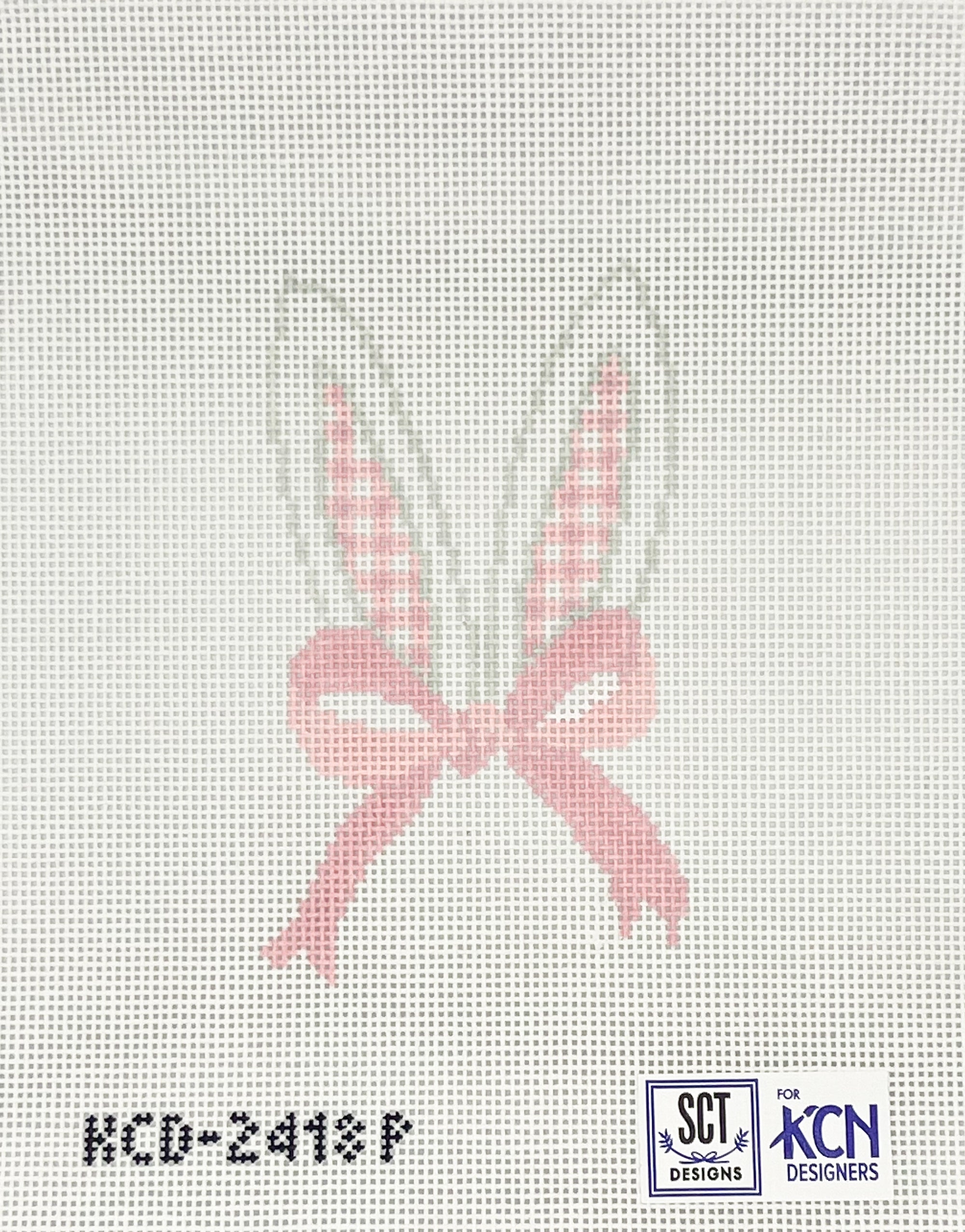 Needlepoint pink bunny ears with bow design on a white canvas 