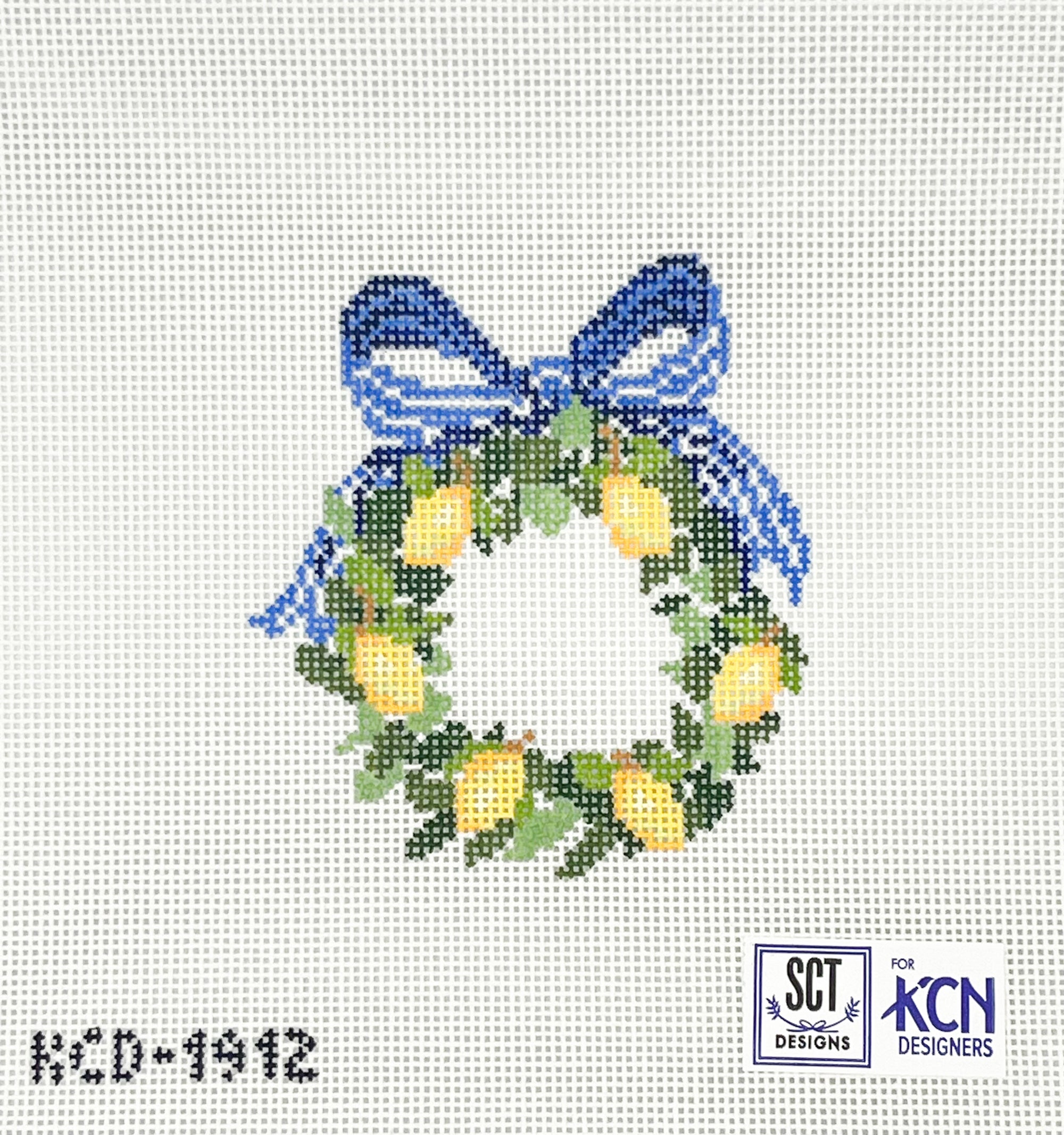 Green wreath with lemons and a blue bow on a white needlepoint canvas