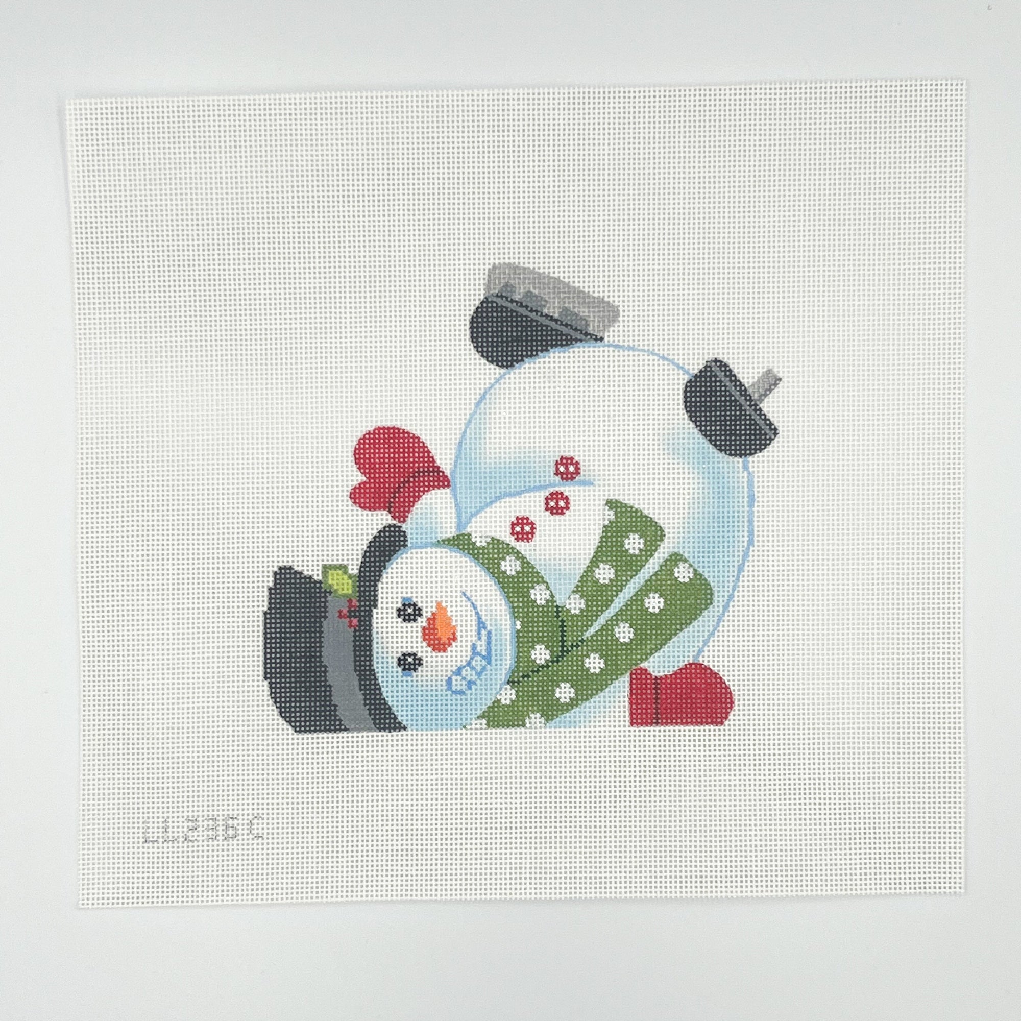 Needlepoint white snowman with green scarf design on a white canas