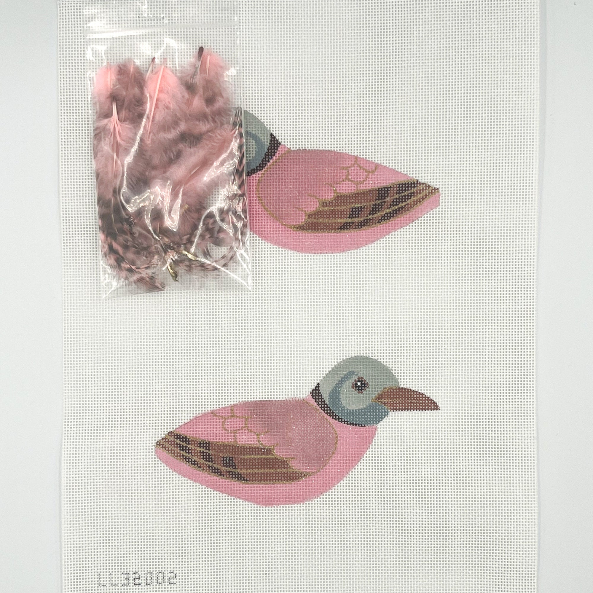 Needlepoint kit with two pink birds design on a white canvas