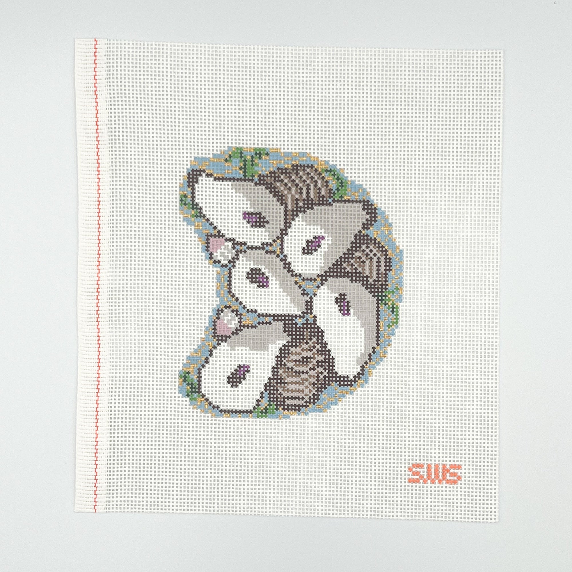 Needlepoint design with white and blue oysters on a white canvas