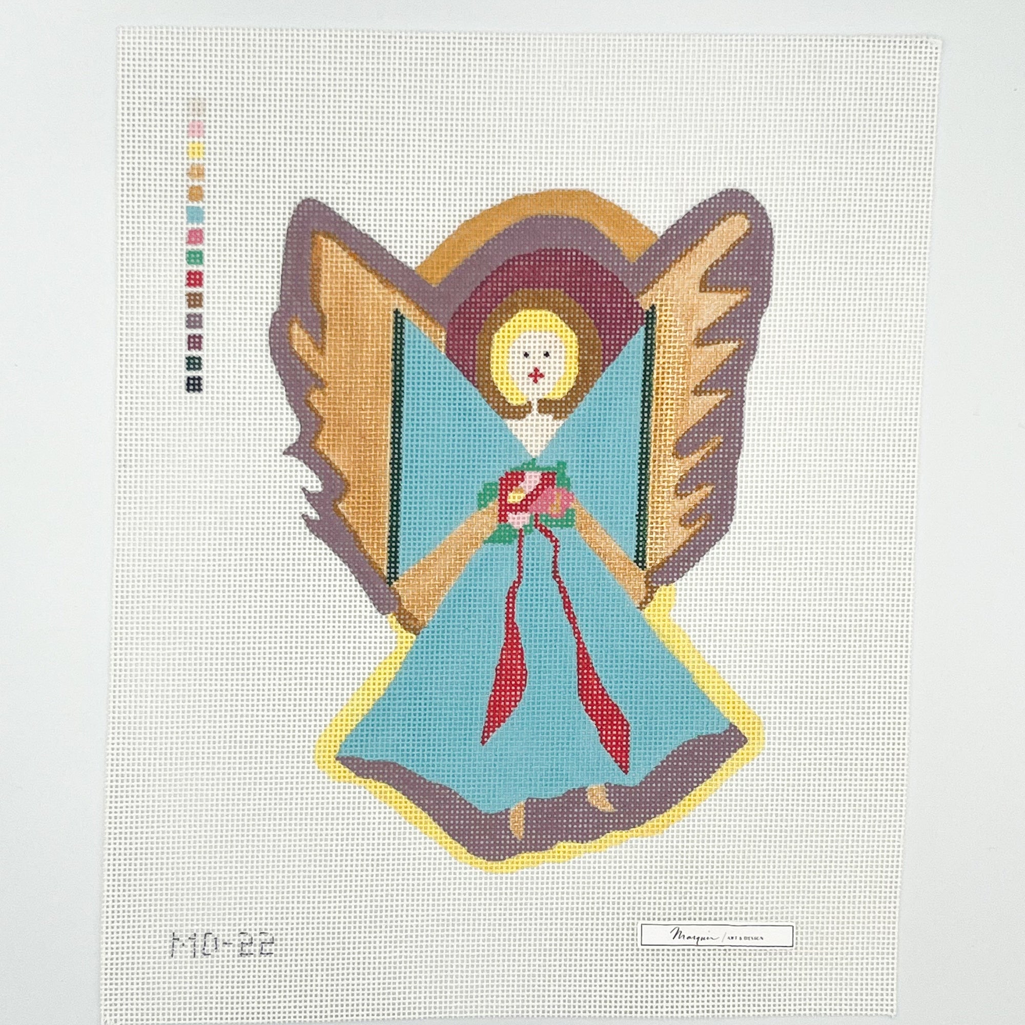 Needlepoint blue angel design on fabric with a grid pattern