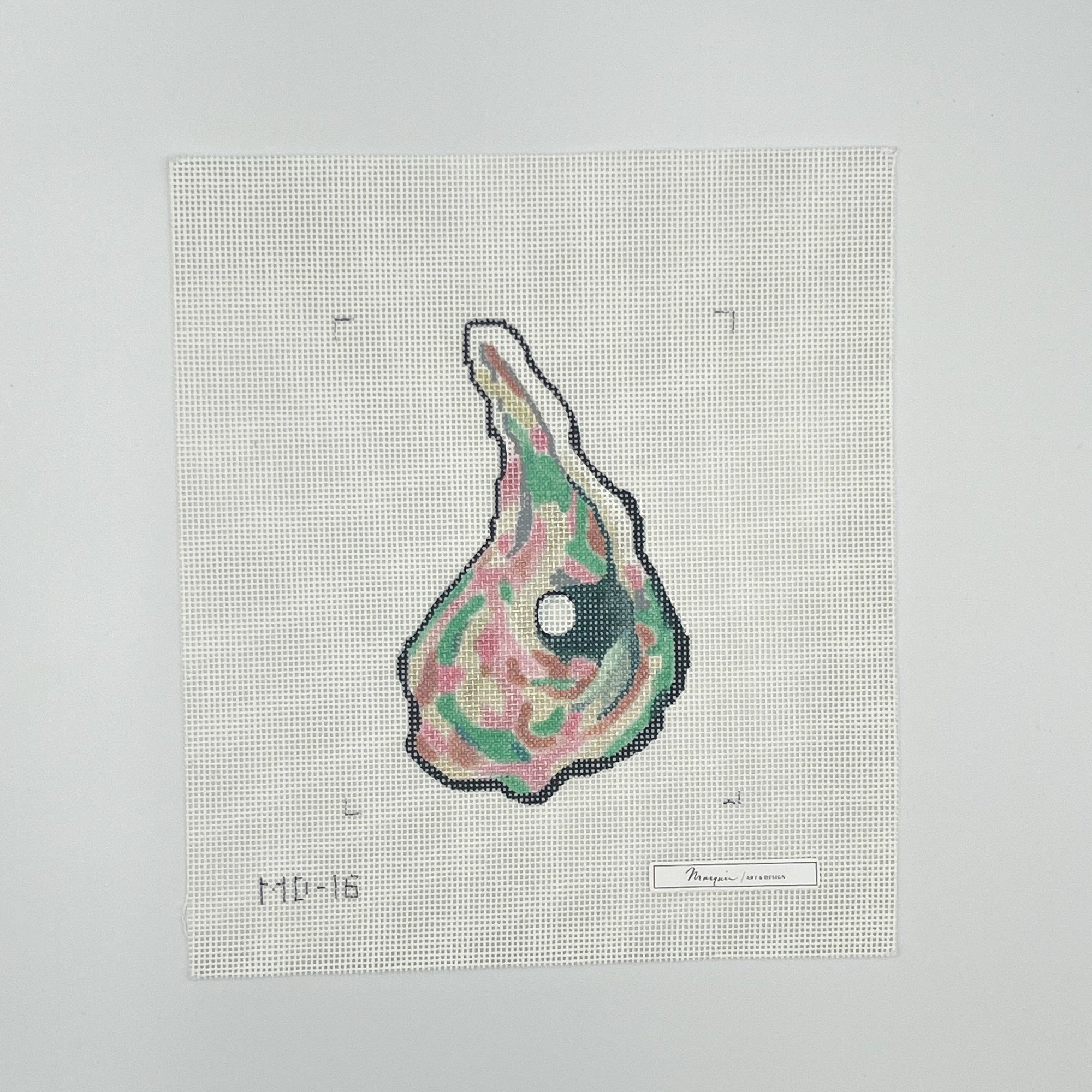 Needlepoint design item with a colorful pattern on a canvas